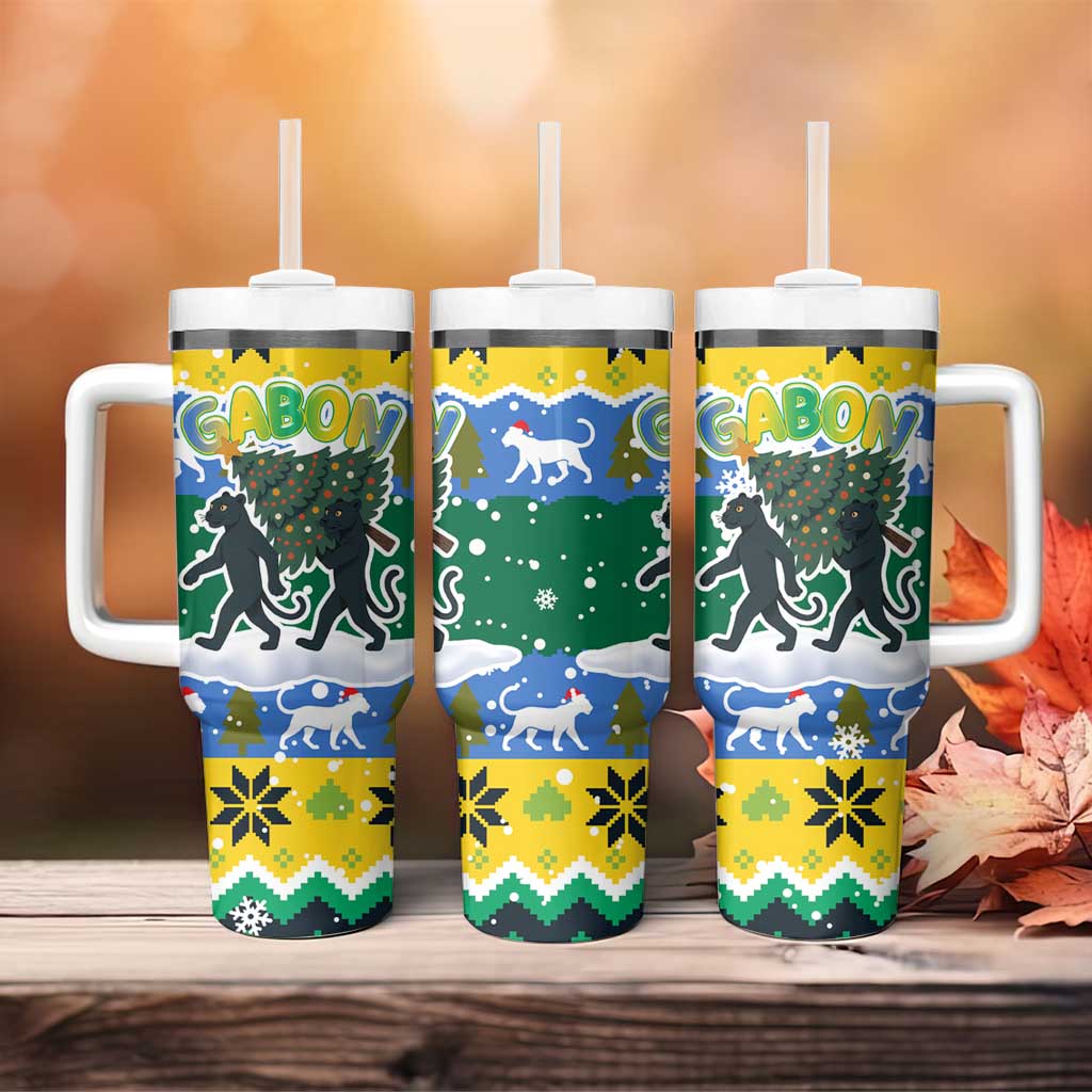 Gabon Christmas Tumbler With Handle with Black Panthers Carrying Tree and Green Yellow Snowflake Pattern - Wonder Print Shop
