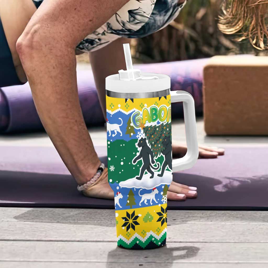 Gabon Christmas Tumbler With Handle with Black Panthers Carrying Tree and Green Yellow Snowflake Pattern - Wonder Print Shop