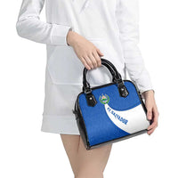 El Salvador Coat of Arms Shoulder Handbag with Curved Text and Blue Patterned Background - Wonder Print Shop
