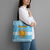 Argentina Christmas Tote Bag with Blue-White Snowflake Pattern, Sun Emblem, and Map Motif - Wonder Print Shop