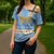 Argentina Christmas Cross Shoulder Shirt with Blue-White Snowflake Pattern, Sun Emblem, and Gaucho Santa Riding Horse Motif - Wonder Print Shop
