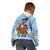 Argentina Christmas Kid Hoodie with Blue-White Snowflake Pattern, Sun Emblem, and Gaucho Santa Riding Horse Motif - Wonder Print Shop