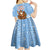 Argentina Christmas Kid Short Sleeve Dress with Blue-White Snowflake Pattern, Sun Emblem, and Gaucho Santa Riding Horse Motif - Wonder Print Shop