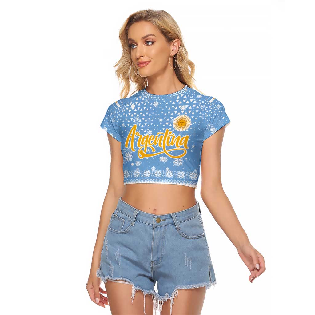 Argentina Christmas Raglan Cropped T Shirt with Blue-White Snowflake Pattern, Sun Emblem, and Gaucho Santa Riding Horse Motif - Wonder Print Shop
