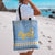 Argentina Christmas Tote Bag with Blue-White Snowflake Pattern, Sun Emblem, and Gaucho Santa Riding Horse Motif - Wonder Print Shop