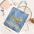 Argentina Christmas Tote Bag with Blue-White Snowflake Pattern, Sun Emblem, and Gaucho Santa Riding Horse Motif - Wonder Print Shop