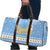 Argentina Christmas Travel Bag with Blue-White Snowflake Pattern, Sun Emblem, and Gaucho Santa Riding Horse Motif - Wonder Print Shop