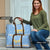 Argentina Christmas Travel Bag with Blue-White Snowflake Pattern, Sun Emblem, and Gaucho Santa Riding Horse Motif - Wonder Print Shop