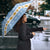 Argentina Christmas Umbrella with Blue-White Snowflake Pattern, Sun Emblem, and Gaucho Santa Riding Horse Motif - Wonder Print Shop