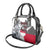 Greenland Shoulder Handbag with Arctic Fox, Mountains, and Frozen Yet Fierce Text Design