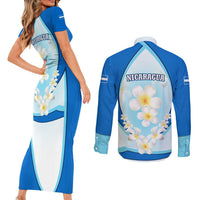 Nicaragua National Emblem Couples Matching Short Sleeve Bodycon Dress and Long Sleeve Button Shirt with White Flor de Sacuanjoche and Blue Gradient Design - Wonder Print Shop