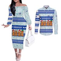 Uruguay Christmas Couples Matching Off The Shoulder Long Sleeve Dress and Long Sleeve Button Shirt with Capybaras Holiday Tree Sun Emblem and Blue Festive Pattern - Wonder Print Shop