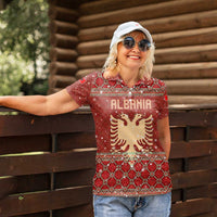 Albania Christmas Women Polo Shirt with Red Geometric Design, Golden Double-Headed Eagle, and Santa Motif - Wonder Print Shop