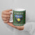 Guadeloupe Christmas Ceramic Mug with Green-Red Plaid Design, Sun and Sugarcane Emblem, and Santa Sleigh Motif - Wonder Print Shop