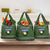 Guadeloupe Christmas Grocery Bag with Green-Red Plaid Design, Sun and Sugarcane Emblem, and Santa Sleigh Motif - Wonder Print Shop