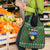 Guadeloupe Christmas Grocery Bag with Green-Red Plaid Design, Sun and Sugarcane Emblem, and Santa Sleigh Motif - Wonder Print Shop