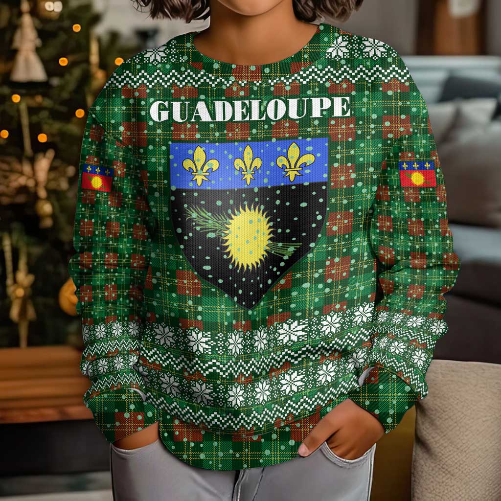 Guadeloupe Christmas Kid Ugly Christmas Sweater with Green-Red Plaid Design, Sun and Sugarcane Emblem, and Santa Sleigh Motif - Wonder Print Shop