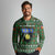 Guadeloupe Christmas Long Sleeve Polo Shirt with Green-Red Plaid Design, Sun and Sugarcane Emblem, and Santa Sleigh Motif - Wonder Print Shop