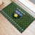 Guadeloupe Christmas Rubber Doormat with Green-Red Plaid Design, Sun and Sugarcane Emblem, and Santa Sleigh Motif - Wonder Print Shop