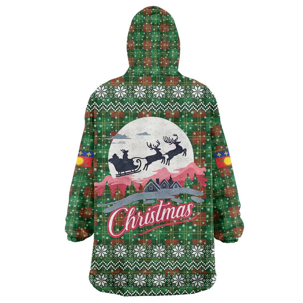 Guadeloupe Christmas Wearable Blanket Hoodie with Green-Red Plaid Design, Sun and Sugarcane Emblem, and Santa Sleigh Motif - Wonder Print Shop