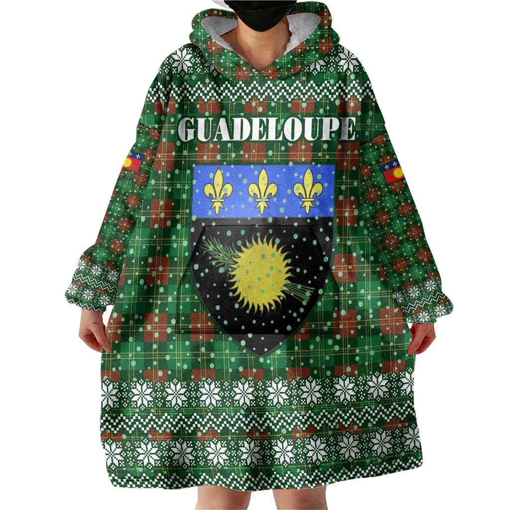 Guadeloupe Christmas Wearable Blanket Hoodie with Green-Red Plaid Design, Sun and Sugarcane Emblem, and Santa Sleigh Motif - Wonder Print Shop