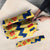 Chad Christmas Umbrella with Yellow-Blue Geometric Design, National Coat of Arms, and Festive Motif - Wonder Print Shop