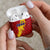 Chad Christmas AirPods Case with Red-Yellow Festive Pattern, National Coat of Arms, and Snowflake Accents - Wonder Print Shop