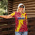 Chad Christmas Women Polo Shirt with Red-Yellow Festive Pattern, National Coat of Arms, and Snowflake Accents - Wonder Print Shop