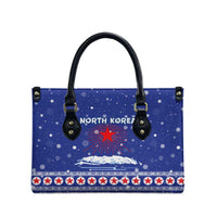 North Korea Christmas Leather Bag with Blue Pattern, Red Star, and Snowy Mountain Motif - Wonder Print Shop