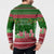 Oman Christmas Button Sweatshirt with Green-Red Pattern, Mosque and Fort Landmarks, and Festive Ornament Motif - Wonder Print Shop