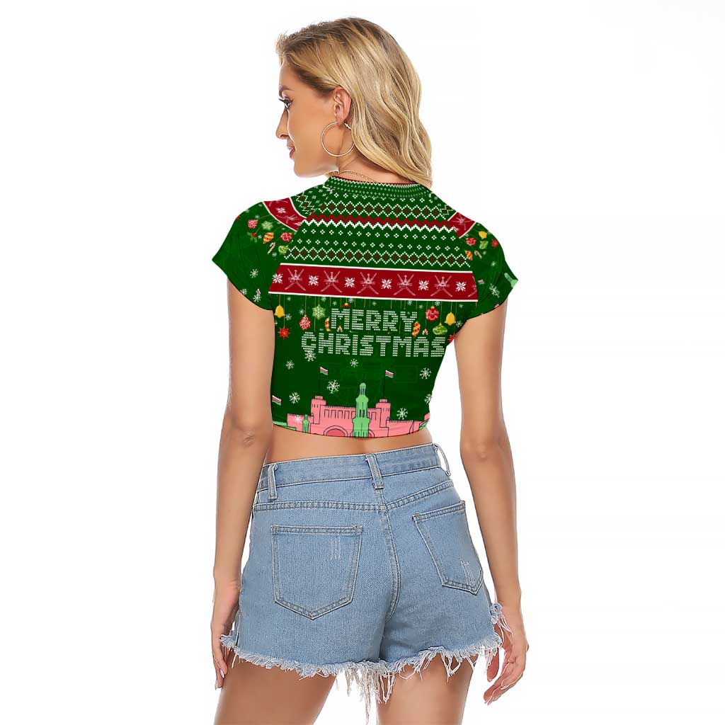 Oman Christmas Raglan Cropped T Shirt with Green-Red Pattern, Mosque and Fort Landmarks, and Festive Ornament Motif - Wonder Print Shop