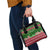 Oman Christmas Shoulder Handbag with Green-Red Pattern, Mosque and Fort Landmarks, and Festive Ornament Motif - Wonder Print Shop
