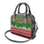 Oman Christmas Shoulder Handbag with Green-Red Pattern, Mosque and Fort Landmarks, and Festive Ornament Motif - Wonder Print Shop
