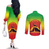 Ethiopia Christmas Couples Matching Off The Shoulder Long Sleeve Dress and Long Sleeve Button Shirt with Mountain Gazelle Sunset Ethiopian Flag Colors and Tribal Pattern Design - Wonder Print Shop