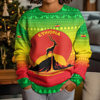 Ethiopia Christmas Kid Ugly Christmas Sweater with Mountain Gazelle Sunset Ethiopian Flag Colors and Tribal Pattern Design - Wonder Print Shop