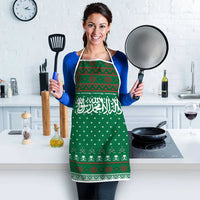 Saudi Arabia Christmas Apron with Green Pattern, Traditional Script Motif, and Camel Caravan Silhouette - Wonder Print Shop