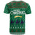 Saudi Arabia Christmas T Shirt with Green Pattern, Traditional Script Motif, and Camel Caravan Silhouette - Wonder Print Shop