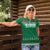 Saudi Arabia Christmas Women Polo Shirt with Green Pattern, Traditional Script Motif, and Camel Caravan Silhouette - Wonder Print Shop