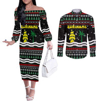 Suriname Christmas Couples Matching Off The Shoulder Long Sleeve Dress and Long Sleeve Button Shirt with Black Festive Pattern, Golden Ship, Palm Tree, and Coat of Arms Motif - Wonder Print Shop