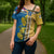 United States Virgin Islands Cross Shoulder Shirt with Blue Yellow Floral Design and Government Seal Bird - Wonder Print Shop