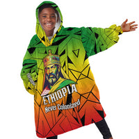 Menelik II Kid Wearable Blanket Hoodie with Crowned Portrait, Ethiopia Never Colonized Text and Pan-African Abstract - Wonder Print Shop