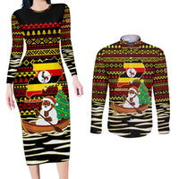 Uganda Christmas Couples Matching Long Sleeve Bodycon Dress and Long Sleeve Button Shirt with Santa in Canoe Christmas Tree Uganda Map Flag and Black Red Yellow Tribal Pattern Design - Wonder Print Shop