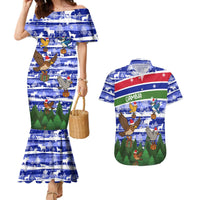 Gambia Christmas Couples Matching Mermaid Dress and Hawaiian Shirt with Santa Birds Gift Boxes Forest Scene and Snowflake Pattern Design - Wonder Print Shop