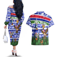 Gambia Christmas Couples Matching Off The Shoulder Long Sleeve Dress and Hawaiian Shirt with Santa Birds Gift Boxes Forest Scene and Snowflake Pattern Design - Wonder Print Shop