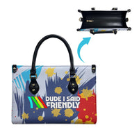 Dude I Said Friendly Graphic Leather Bag with Gold Paint Splatter and Retro Stripes