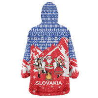 Slovakia Christmas Wearable Blanket Hoodie with Santa and Dancers by Campfire Snowy Mountains and Red Blue Snowflake Pattern Design - Wonder Print Shop