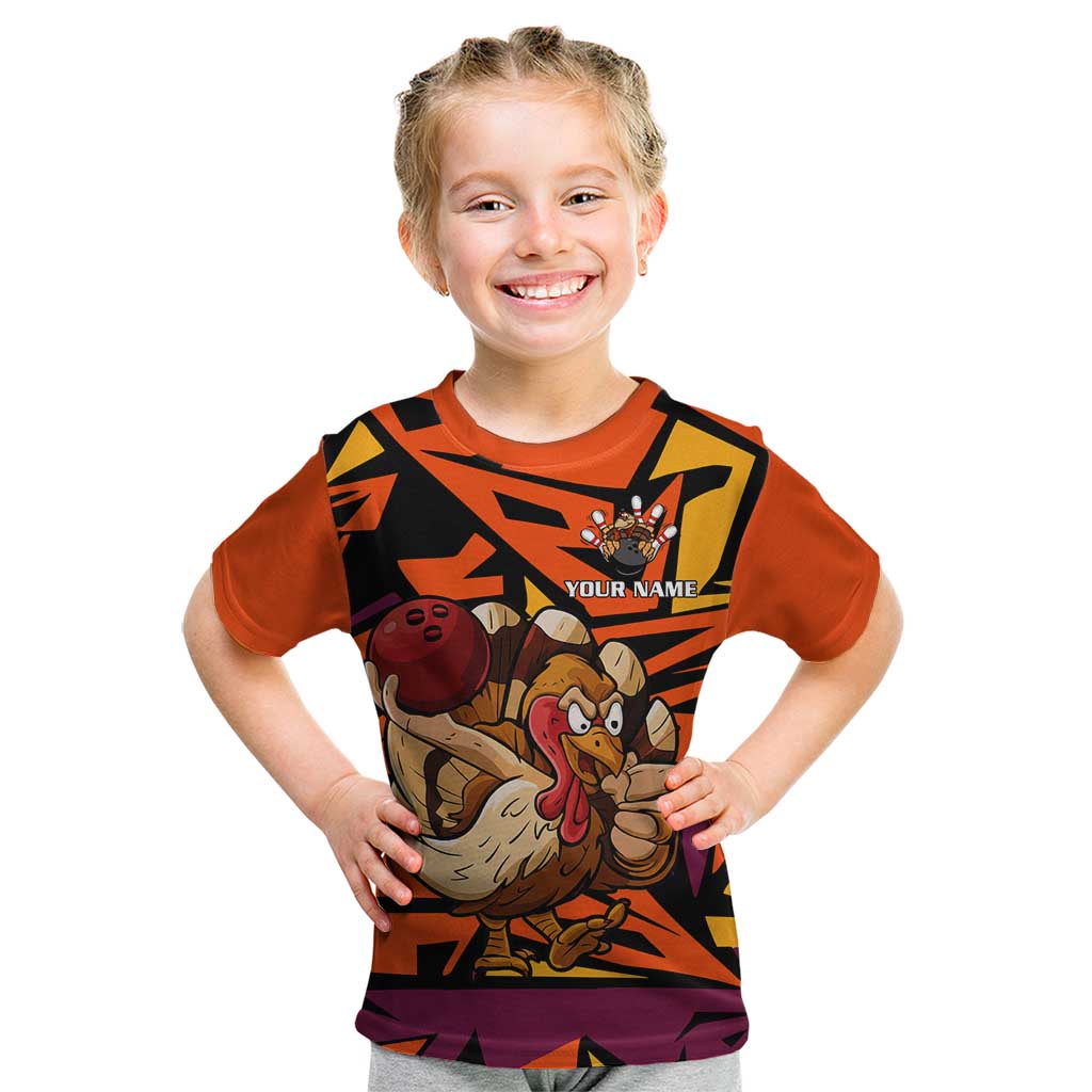 Custom Turkey Bowling Kid T Shirt with Cartoon Turkey Striker and Orange Geometric Pattern - Wonder Print Shop