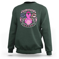 Dark forest green breast cancer awareness sweatshirt with 'survivor' graphic and pink ribbon