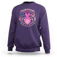 Purple breast cancer awareness sweatshirt with 'survivor' graphic and pink ribbon