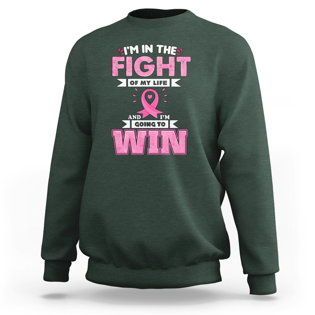 Dark forest green crewneck sweatshirt with pink ribbon and 'FIGHT' and 'WIN' graphic print
